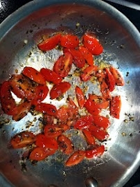 Sautee Tomatoes with oil garlic salt and basil
